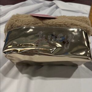 Juicy Couture Gold and Beige Cosmetic Bag on snapped on the sides to make larger